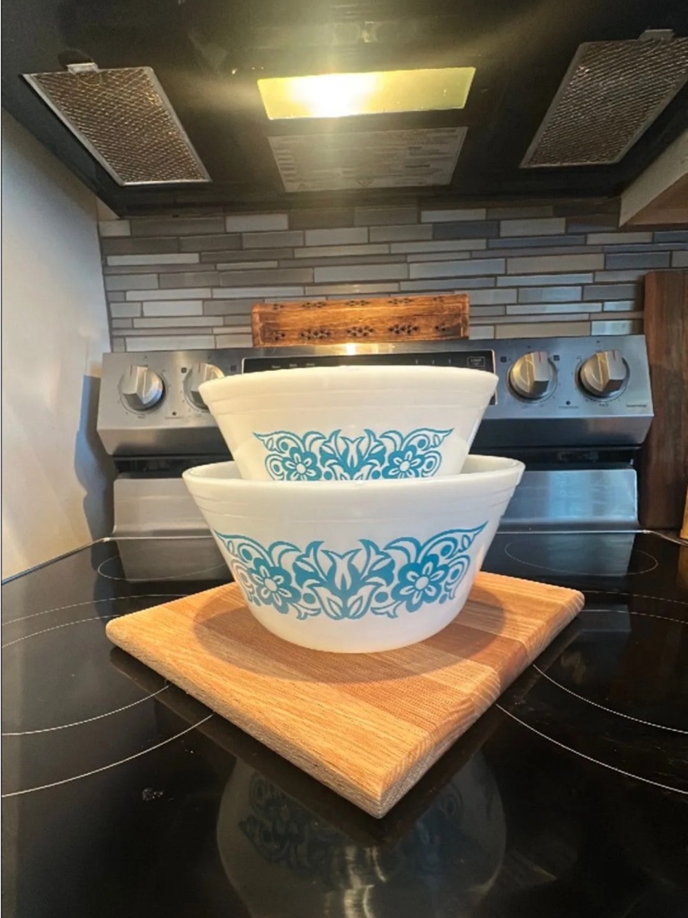 Vintage Federal Glass milk glass mixing bowls with blue floral pattern.